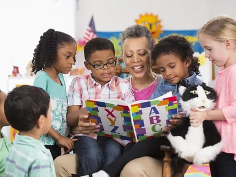 a group of children holding a dog