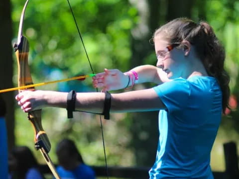 a woman shooting a bow