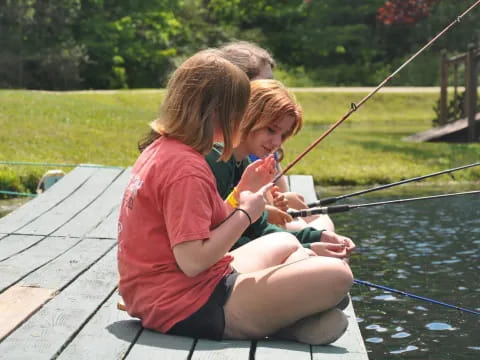 a group of kids fishing