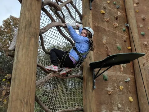 a person climbing a rock wall