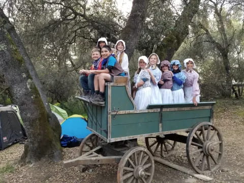 a group of people in a wagon