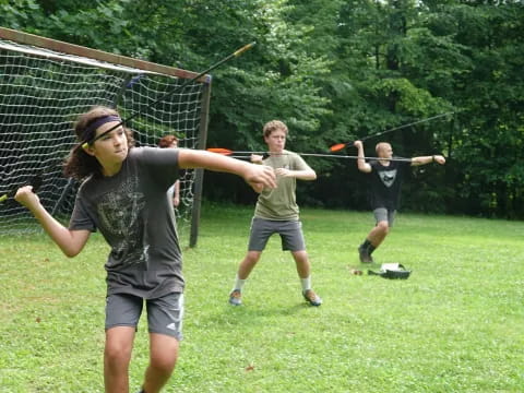 a group of people playing baseball