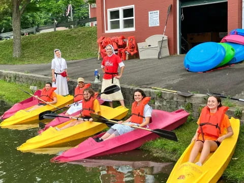 a group of people in kayaks
