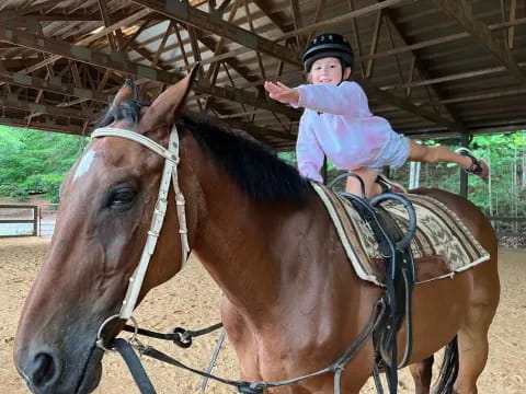a girl riding a horse