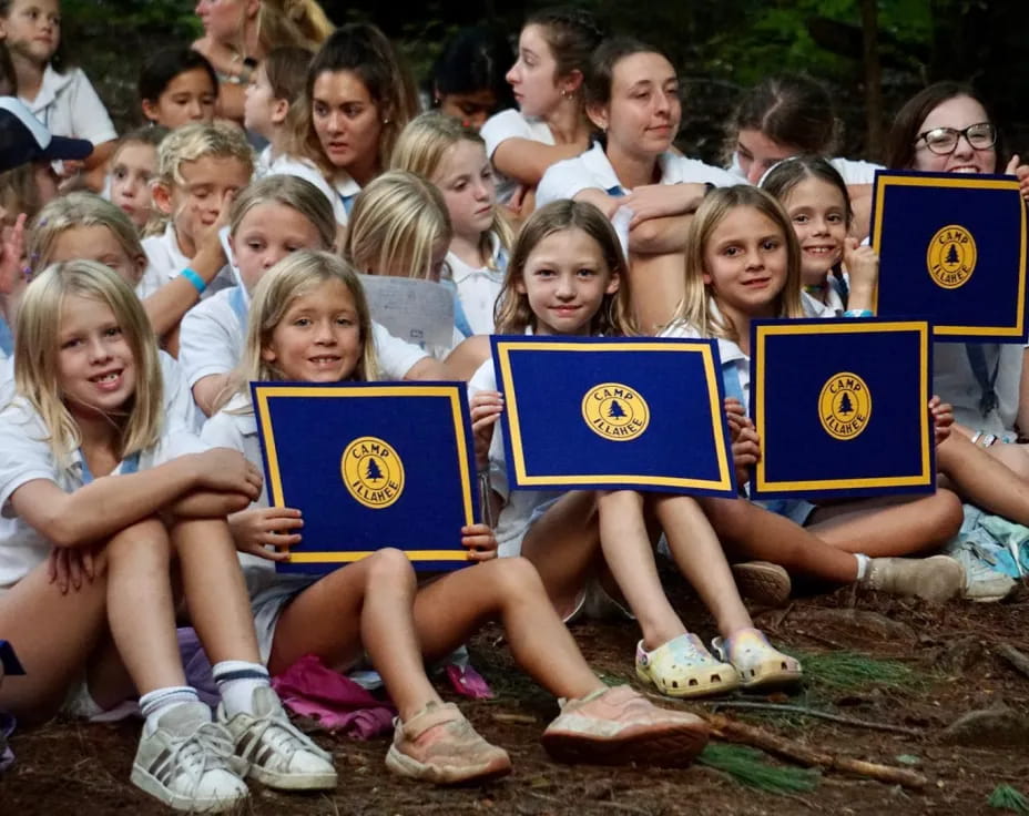 a group of children holding books