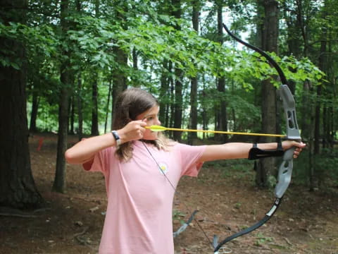 a person holding a bow and arrow