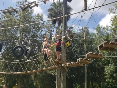 a couple of people on a swing set
