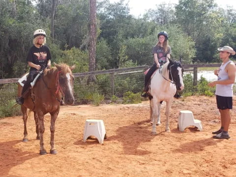 a group of people riding horses