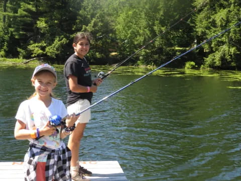 a boy and girl fishing
