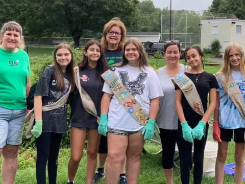 a group of women holding a sign