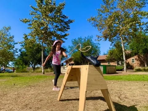 a girl holding a bow and arrow