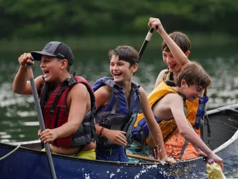 a group of people in a canoe