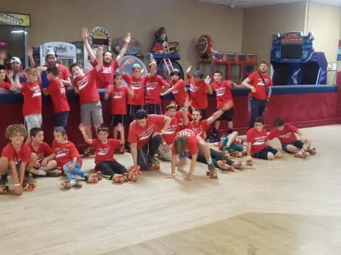 a group of people in red shirts