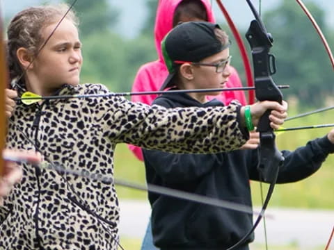 a person holding a bow and arrow
