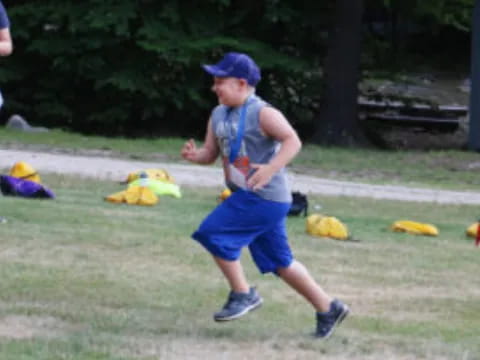 a person running on a grass field
