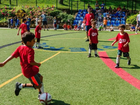 kids playing football on a field