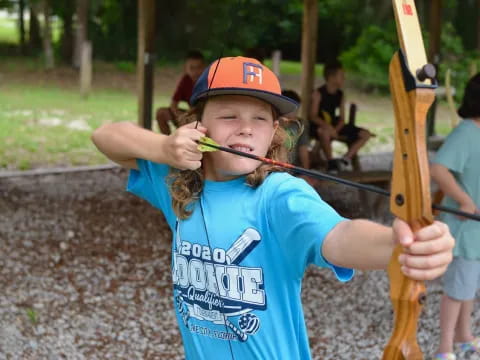 a young girl holding a toy