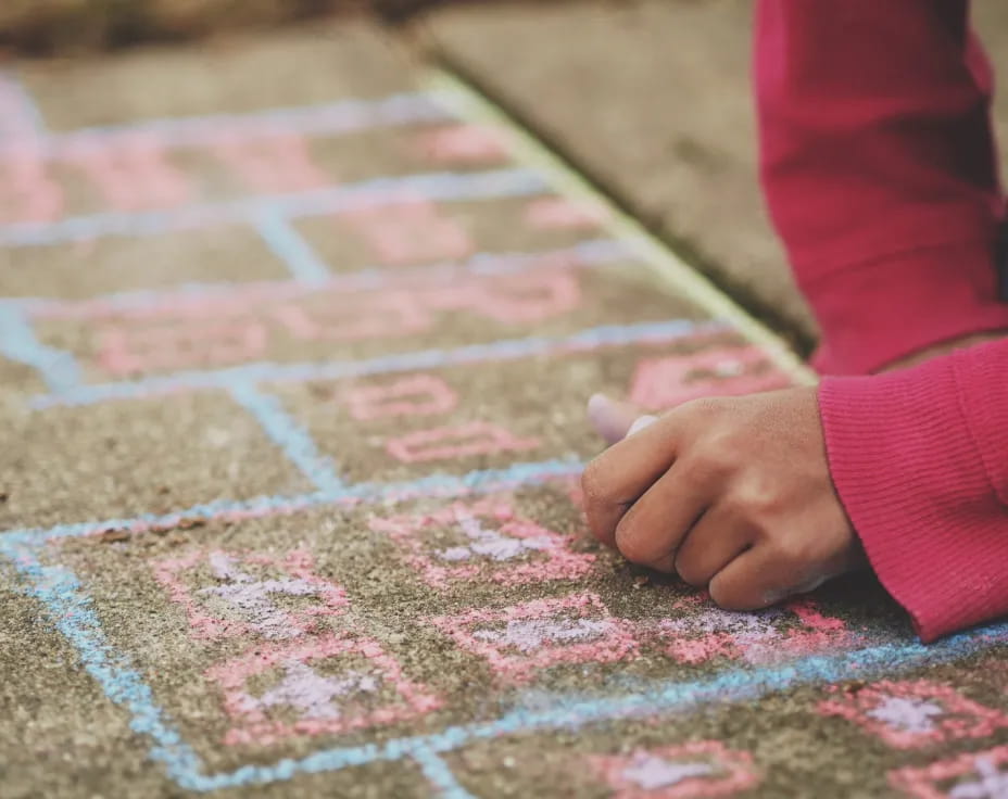 a person's hand on a red carpet