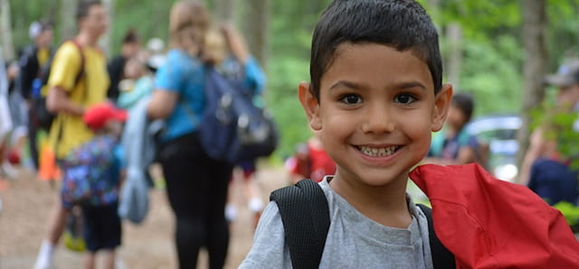 a boy smiling for the camera