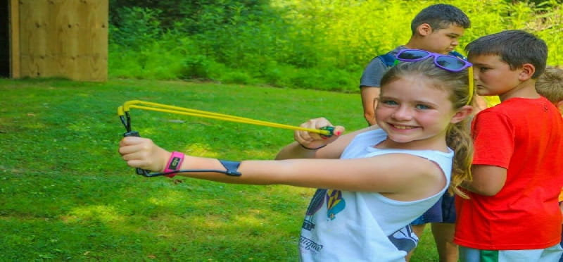 a group of children playing with a toy