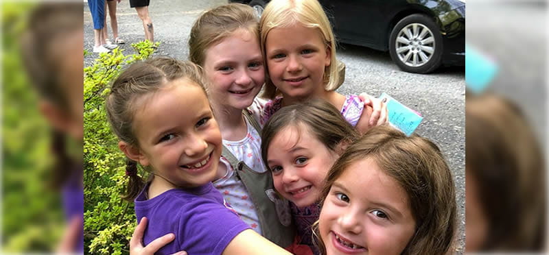 a group of girls posing for a photo