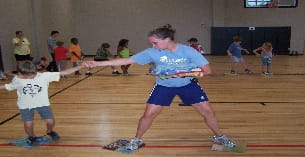 a group of kids playing basketball
