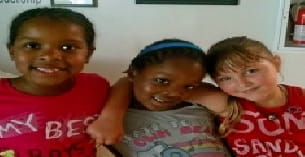 a group of kids smiling