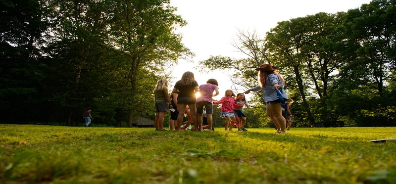 a group of people running in a park