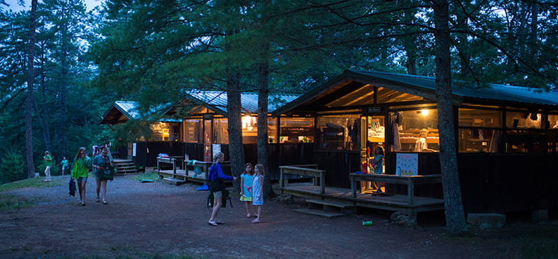 a group of people walking around a park