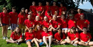 a group of people wearing red shirts