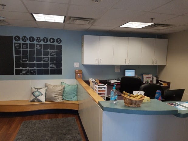 a room with a desk and a computer