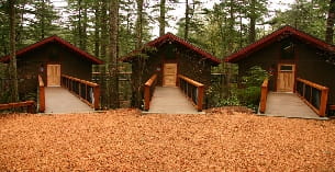 a wooden building with a walkway
