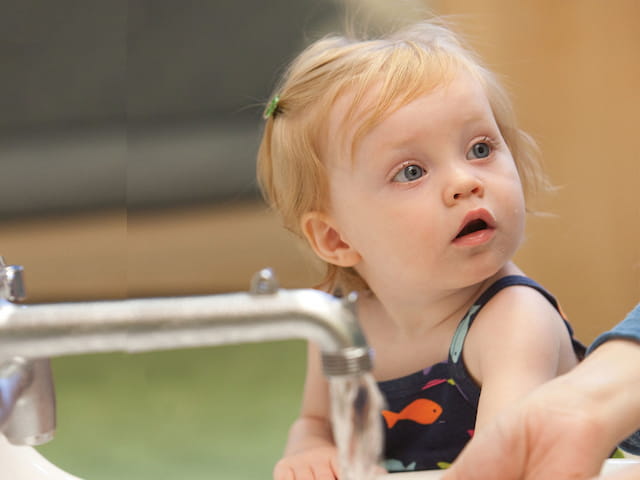 a baby looking at the camera