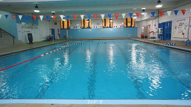 a swimming pool with flags