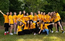 a group of people in yellow shirts