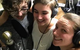 a group of people wearing headphones