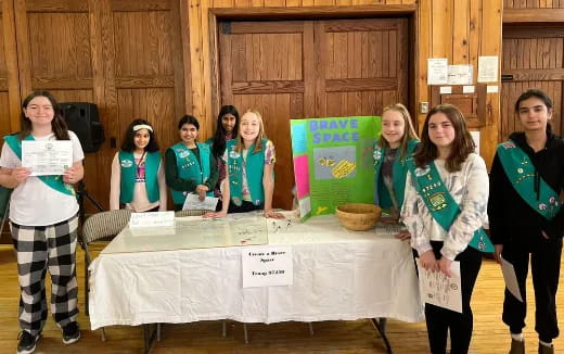 a group of women holding signs