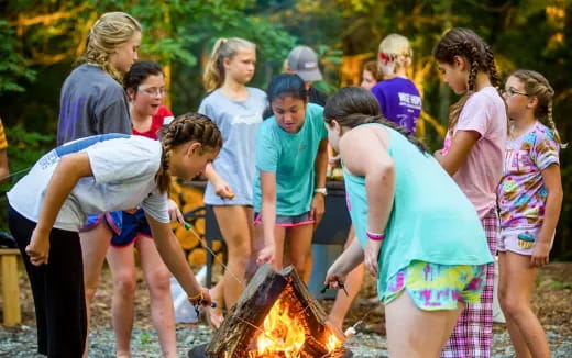 a group of people around a fire