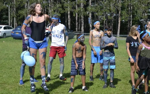 a group of people playing with balls