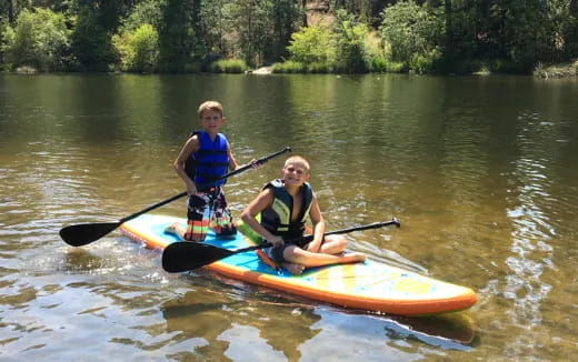 two boys in a canoe