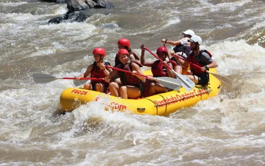 a group of people in a raft