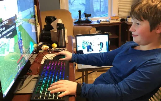 a boy using a computer