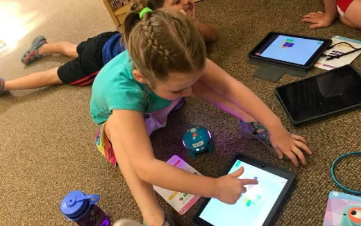 a child playing with a tablet