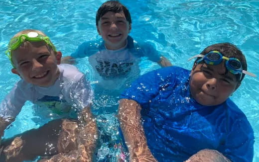 a group of kids in a pool