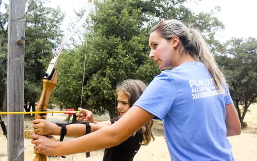 a person shooting a bow