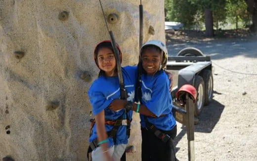 a couple of girls posing for the camera