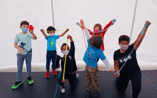 a group of kids wearing masks