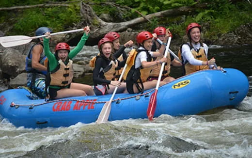 a group of people in a raft