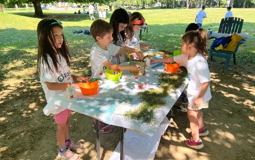 a group of children around a table