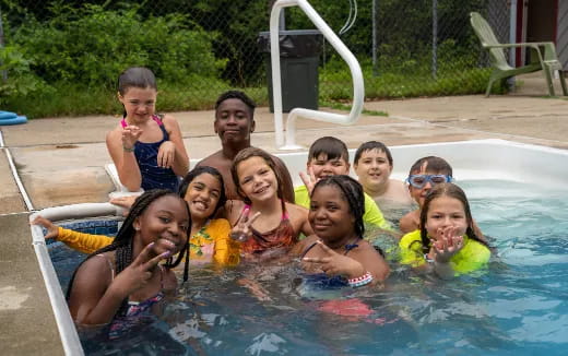 a group of people in a pool